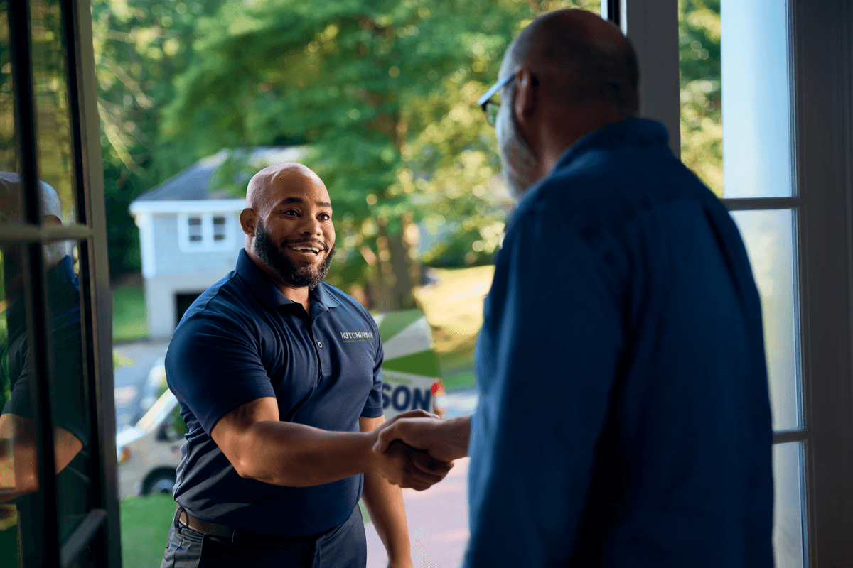 Technician shaking customers hand