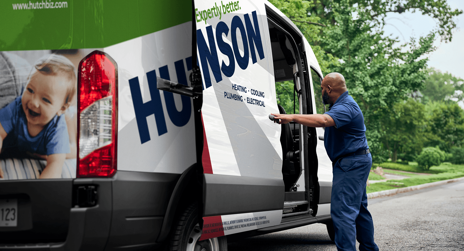 A technician opening the door to the Hutchinson service truck