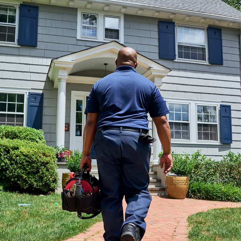A Hutchnison technician arrives at a home ready to provide expert HVAC, plumbing, and electrical services.