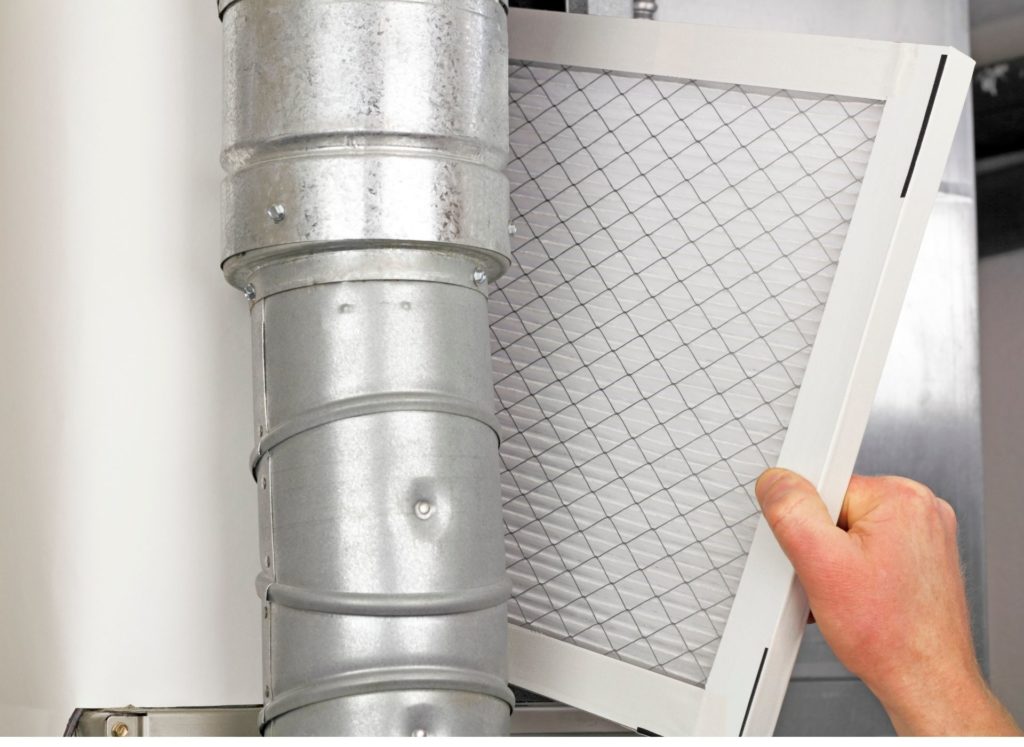 air filter being changed by hutchinson technician
